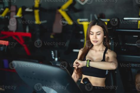 Smart Watch Showing A Heart Rate Of Exercising Woman In Gym