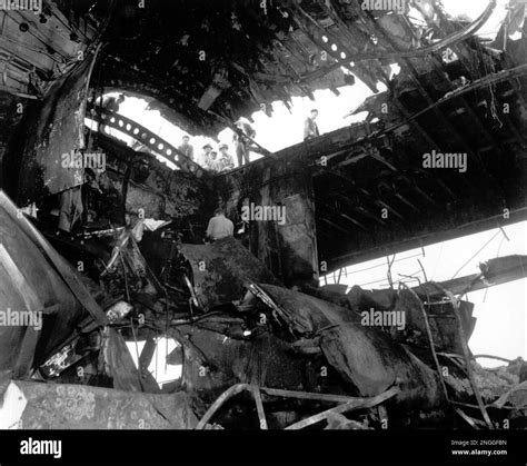 The USS Randolph shows heavy damage to the overhead hangar and flight ...