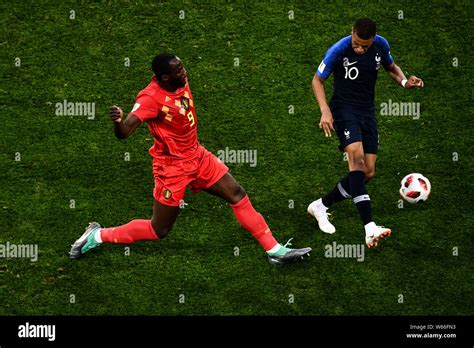 Romelu Lukaku Of Belgium Left Challenges Kylian Mbappe Of France In Their Semifinal Match