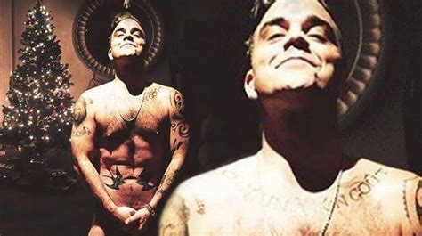 Robbie Williams Poses NAKED To Show Off Mammoth Tattoo Collection In