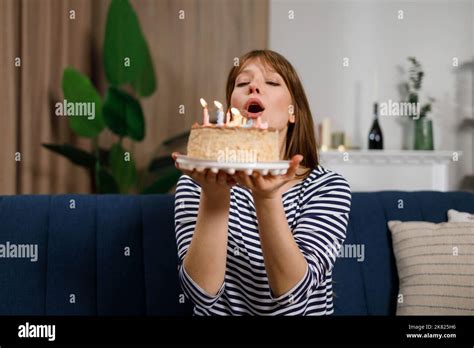 Happy Birthday To Me Young Woman Blowing Out Candles On A Birthday