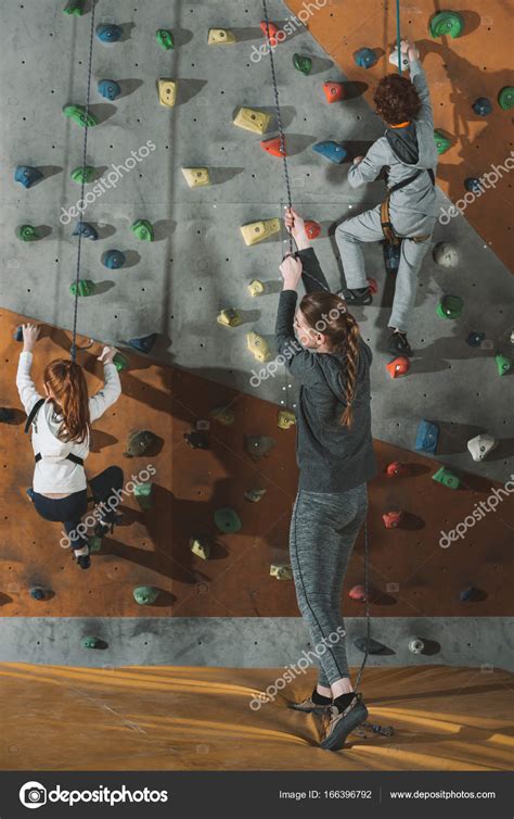 Two little kids climbing wall — Stock Photo © ArturVerkhovetskiy #166396792