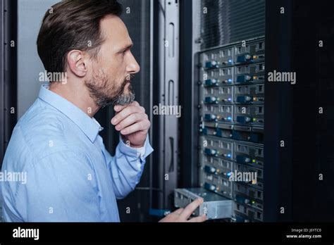 Thoughtful nice man looking for a problem Stock Photo - Alamy 