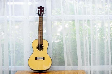 Classical guitar placed in the room 6910174 Stock Photo at Vecteezy