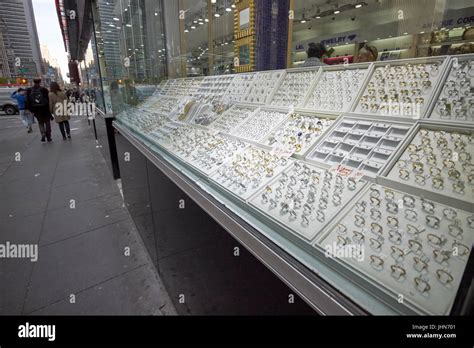 rings in a jewelry store window 6th ave New York City diamond district ...