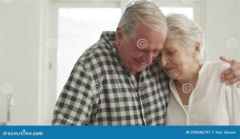 Senior Couple Hug And Love In Retirement Security And Smile At Home