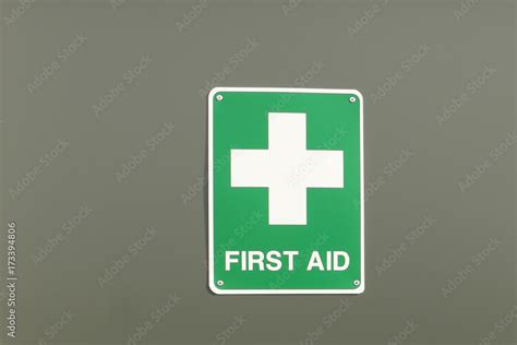 green and white First Aid sign and cross Stock Photo | Adobe Stock