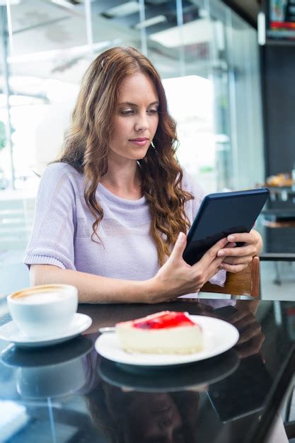 Premium Photo Pretty Brunette Using Her Tablet