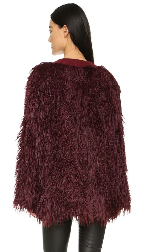 Lyst Dkny Faux Fur Coat In Red