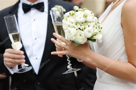 Bride And Groom Holding Champagne Glasses Stock Photo By ©mnstudio 13726467