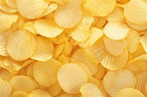 Premium Photo Crispy Potato Chips Close Up Ideal Snack Texture Background