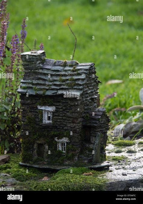 small toy house in garden Stock Photo - Alamy