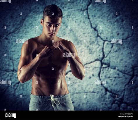 young man in fighting or boxing position Stock Photo - Alamy