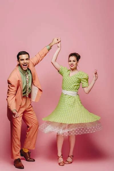 Stylish Dancers Holding Hands While Dancing Boogie Woogie Grey