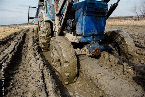 Tractor Stuck In The Mud On A Bad Road Clay Stuck On Wheels Stock