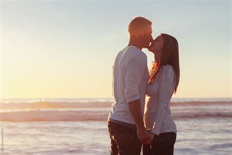 People Kissing On The Beach