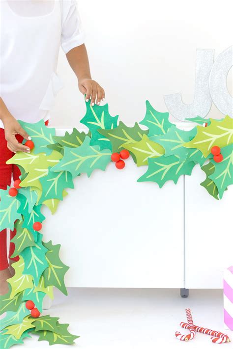 Giant Paper Holly Garland Tutorial | AllFreeChristmasCrafts.com