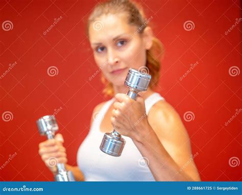 Brunette Fitness Woman Doing Biceps Workouts With Dumbbells Stock