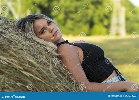 A Lovely Blonde Model Poses Outdoors In A Farm Environment Stock Image Image Of Cheerful