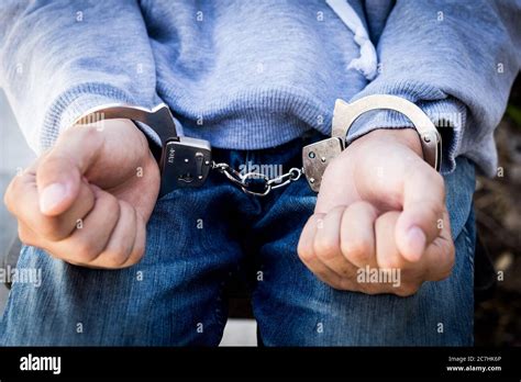 Close Up Prisoner Hands In Handcuffs Arrested Man In Handcuffed Hands