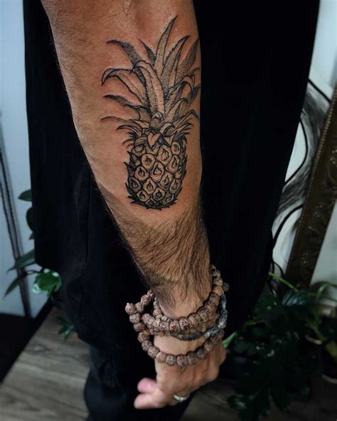 Black pineapple tattoo on the forearm - Tattoogrid.net