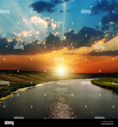 sunset over river Stock Photo - Alamy