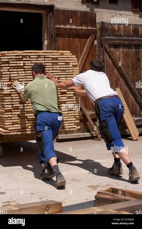 Two men work in a sawmill Engen Baden Württemberg Germany Stock