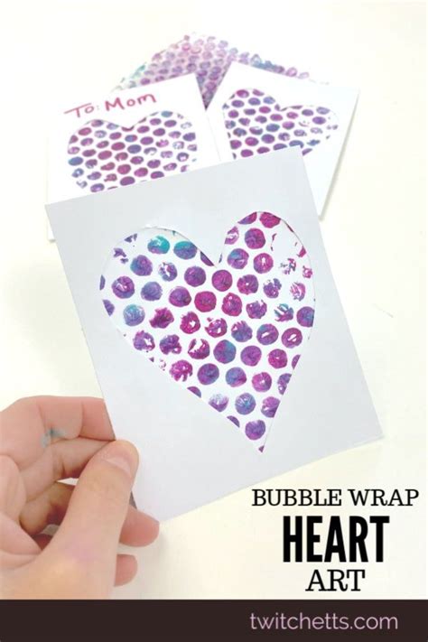 Someone Is Making A Heart Shaped Card For Valentines Day With Bubble