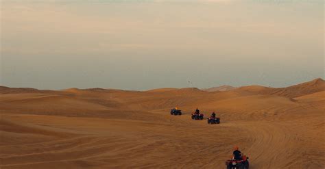 Quads Driving in Sand Dunes · Free Stock Photo