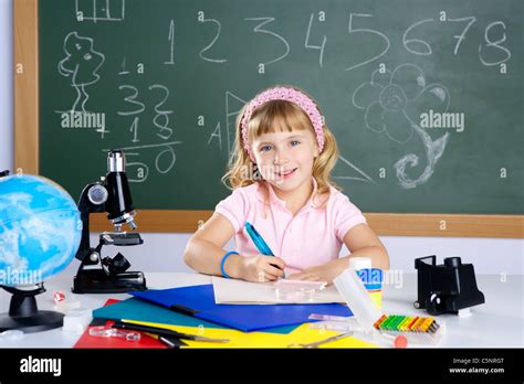 children little girl at school classroom with microscope in science ...