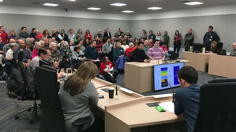 Alaskans Pack Hearing To Testify On Proposed State Budget Cuts Eye On