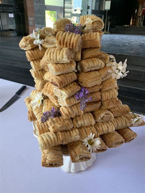 Couple Have Wedding Cake Made Out Of Greggs Vegan Sausage Rolls Need