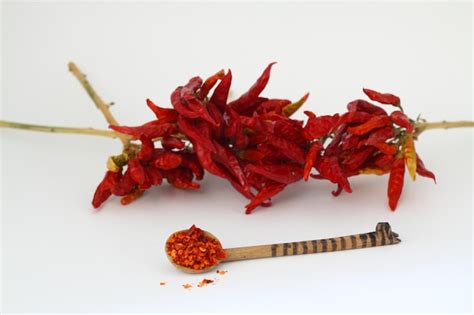 Premium Photo Red Dried Crushed Hot Chili Peppers And Chili Flakes Or Powder Isolated On White