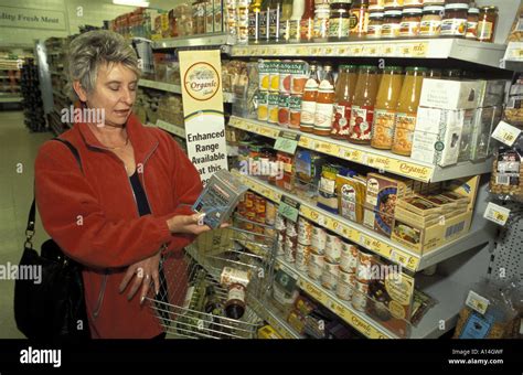 Woman In Coop Buying Organic Food Stock Photo Alamy