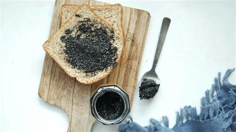 Black sesame spread on a bread 24183588 Stock Video at Vecteezy