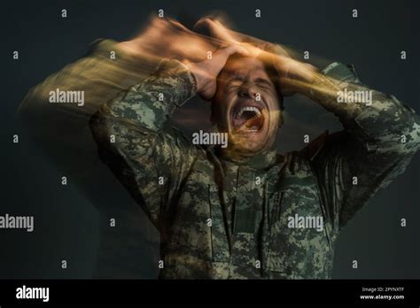 Long Exposure Of Soldier In Uniform Screaming While Suffering From