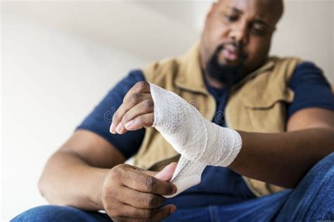 A Man Getting Injured Putting on Bandages Stock Photo - Image of illness, accident: 115360606