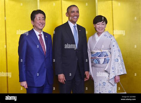 Japanese Prime Minister Shinzo Abe and his wife Akie Abe, stand with U ...