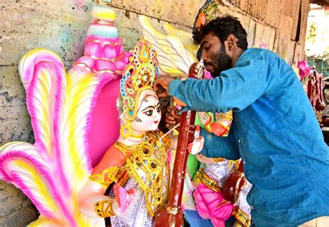 Nagaon An Artist Is Seen Giving Final Touches To An Idol Of Goddess