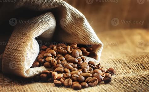 Roasted Coffee Beans Spill Out Of The Bag Stock Photo At Vecteezy