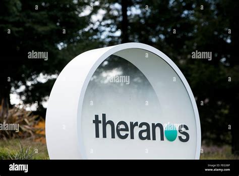 A logo sign outside of the headquarters of Theranos in Palo Alto ...