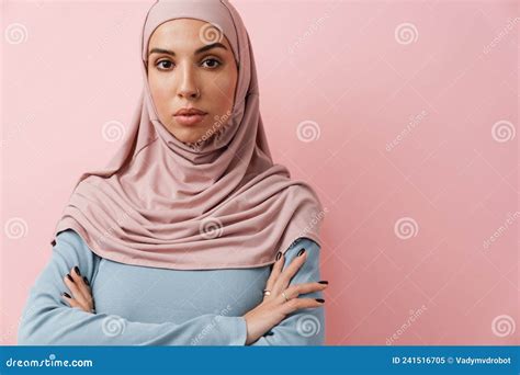 A Confident Muslim Woman In Pink Hijab Looking At The Camera Stock