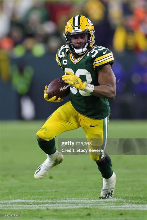 Aaron Jones Of The Green Bay Packers Runs For Yards During A Game