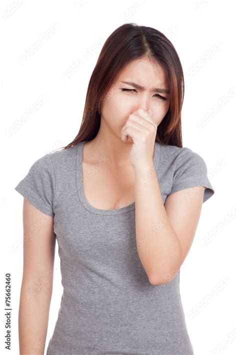 Young Asian Woman Holding Her Nose Because Of A Bad Smell Stock Photo