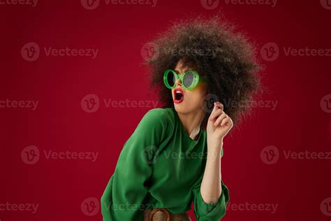 Beauty Fashion woman green dress afro hairstyle dark glasses twenty