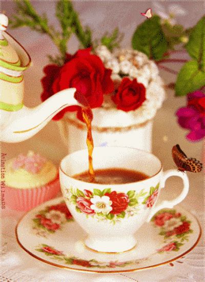 A Cup Of Coffee Is Being Poured Into A Teacup With Red Roses In The