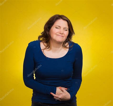 Woman having stomach pain Stock Photo by ©SIphotography 52367733