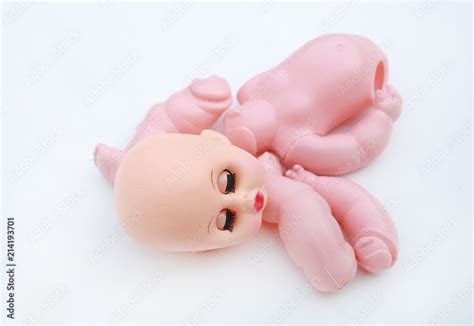 Creepy Broken And Naked Doll Isolated On White Background Separated Of A Doll Stock Photo