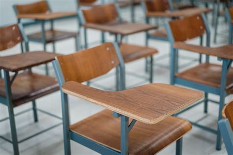 Premium Photo Empty University Classroom With Many Wooden Chairs Wooden Chairs Well Arranged