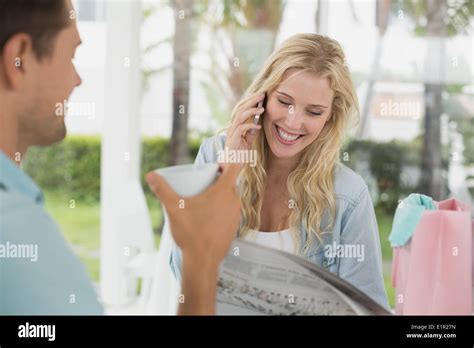 Pretty Blonde Talking On Phone While Having Coffee With Boyfriend Stock Photo Alamy